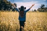 woman raising both hands