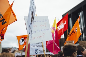 group of people holding signages