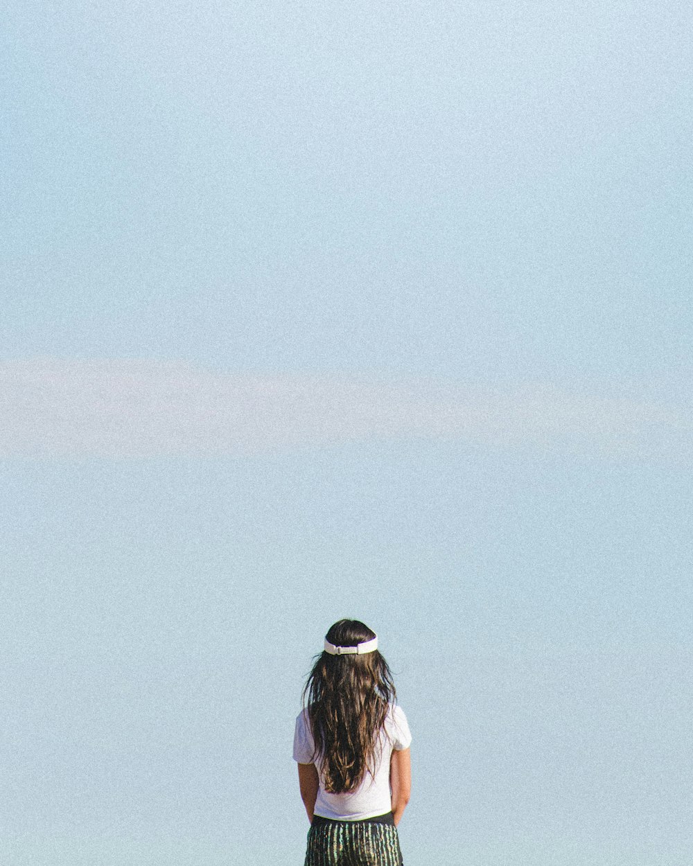 woman wears white crew-neck shirt