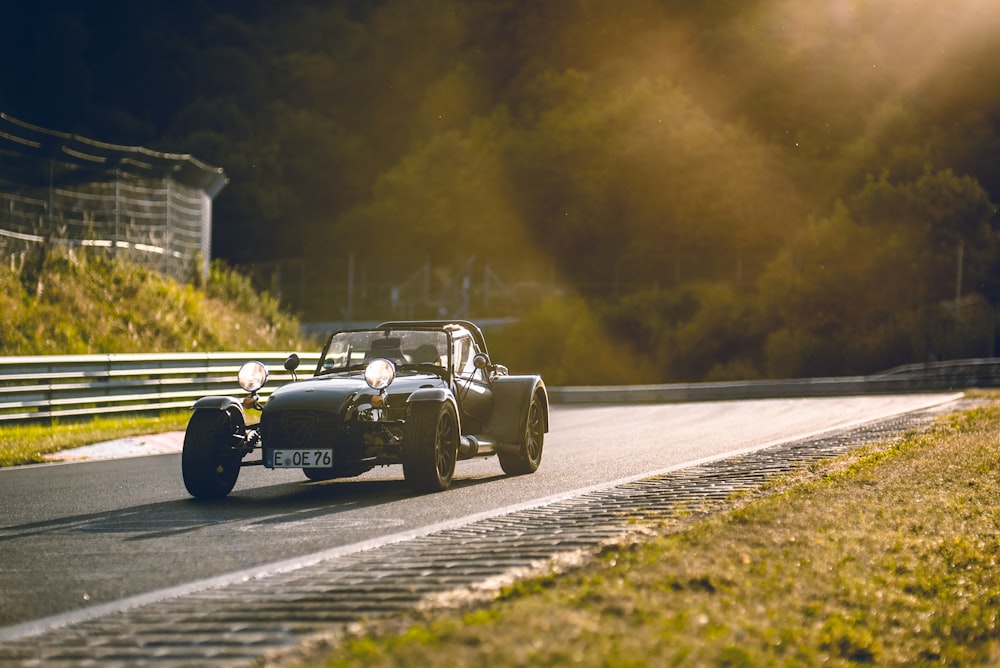 black coupe on road