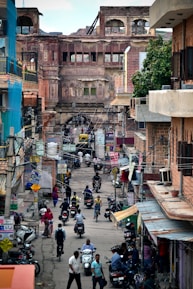 people on street between buildings