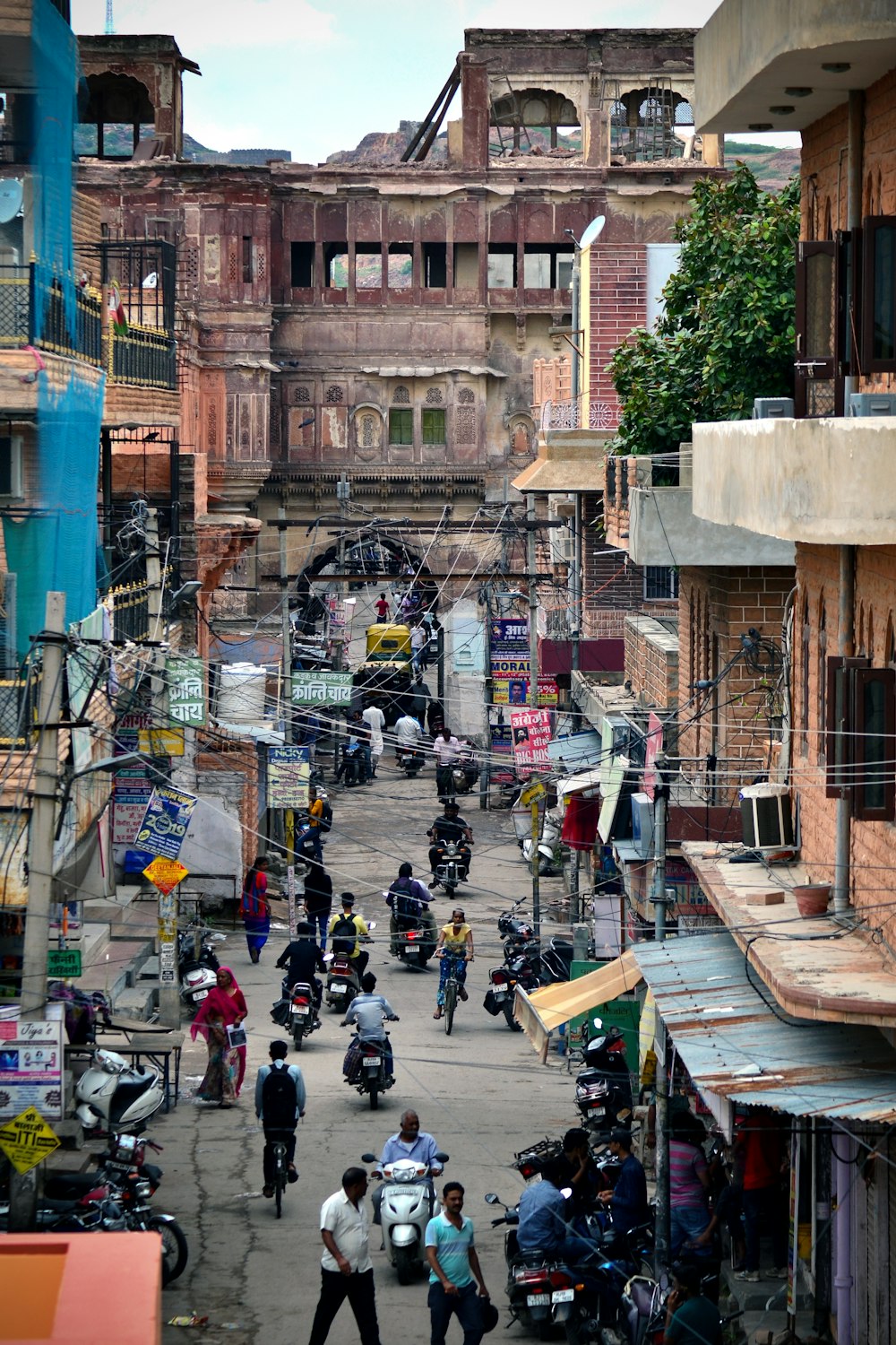 people on street between buildings