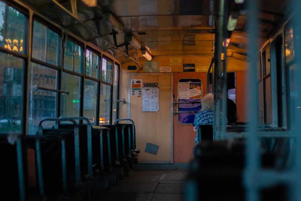 a person standing in the doorway of a bus