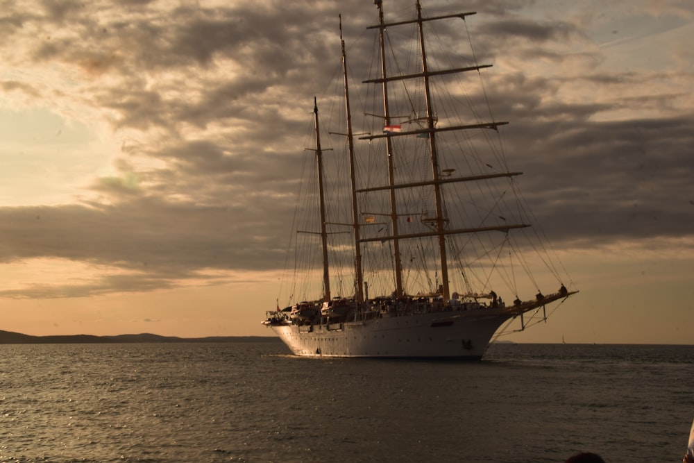 white and brown sailing ship