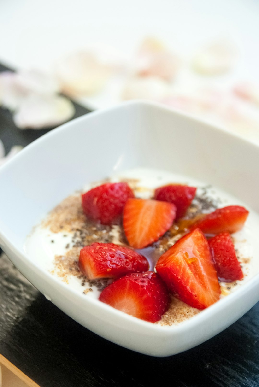 strawberry slices in white bowl