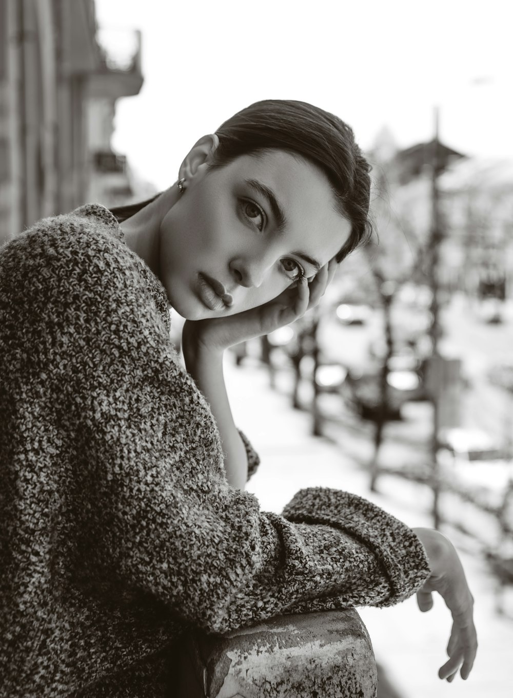 woman leaning on wall