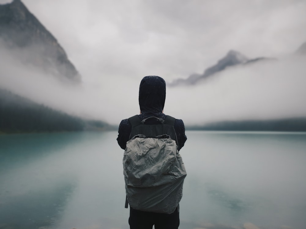 person looking at lake