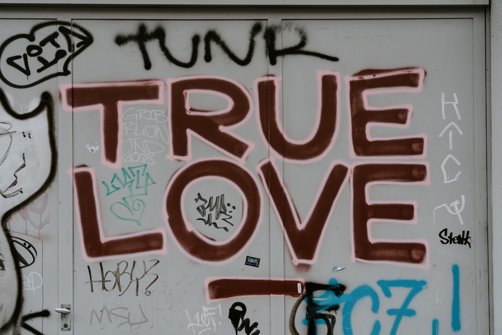 gray locker with graffiti