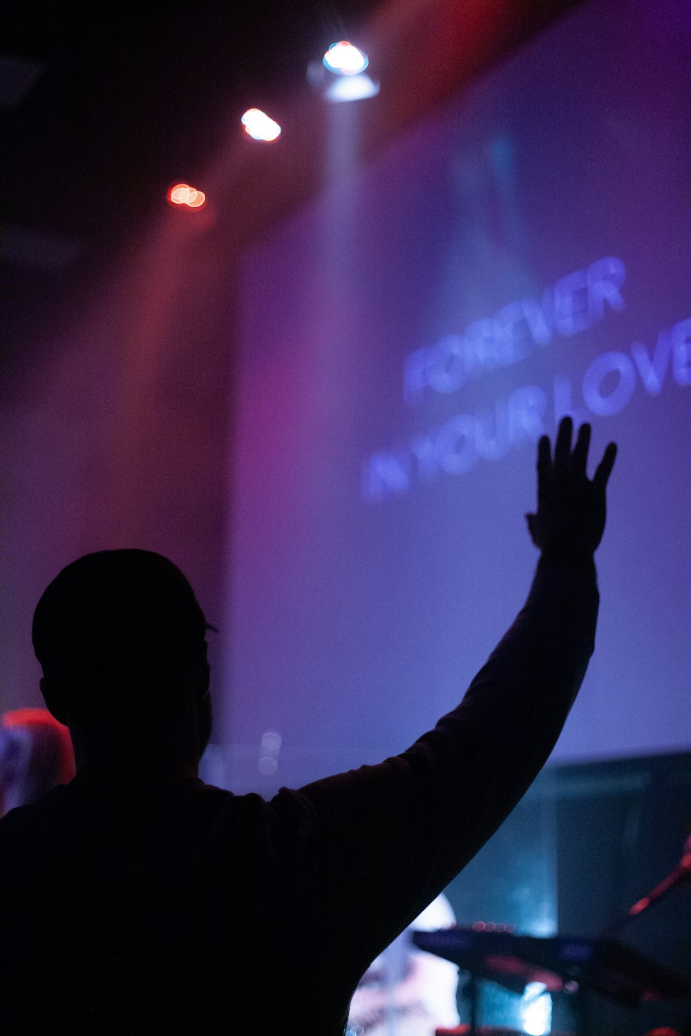 person standing in front of stage