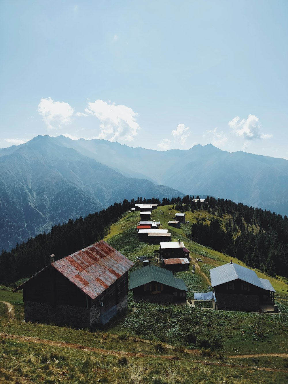 wide angle photography of buildings near mountain during daytime