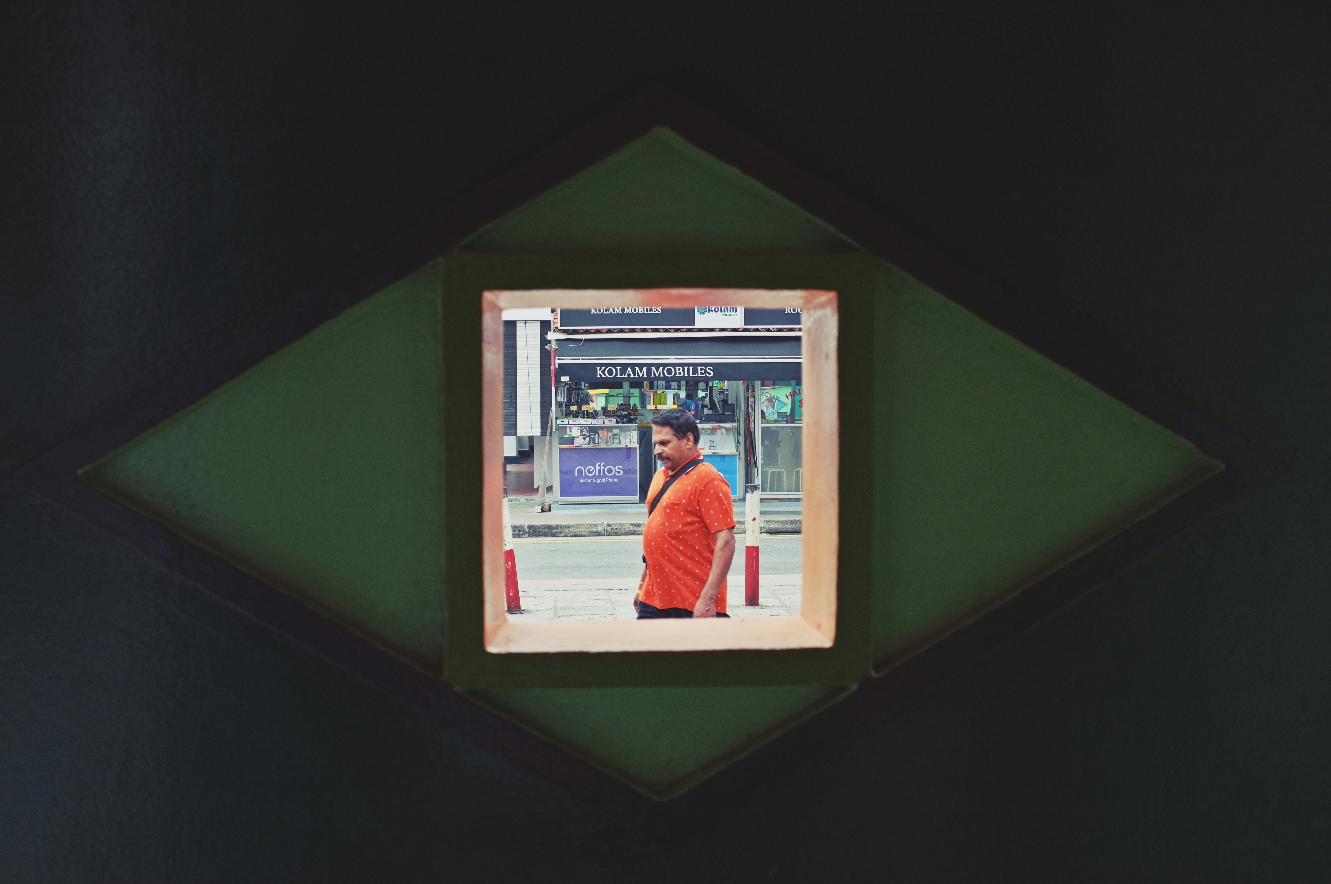 THROUGH AN EYE SHAPED HOLE