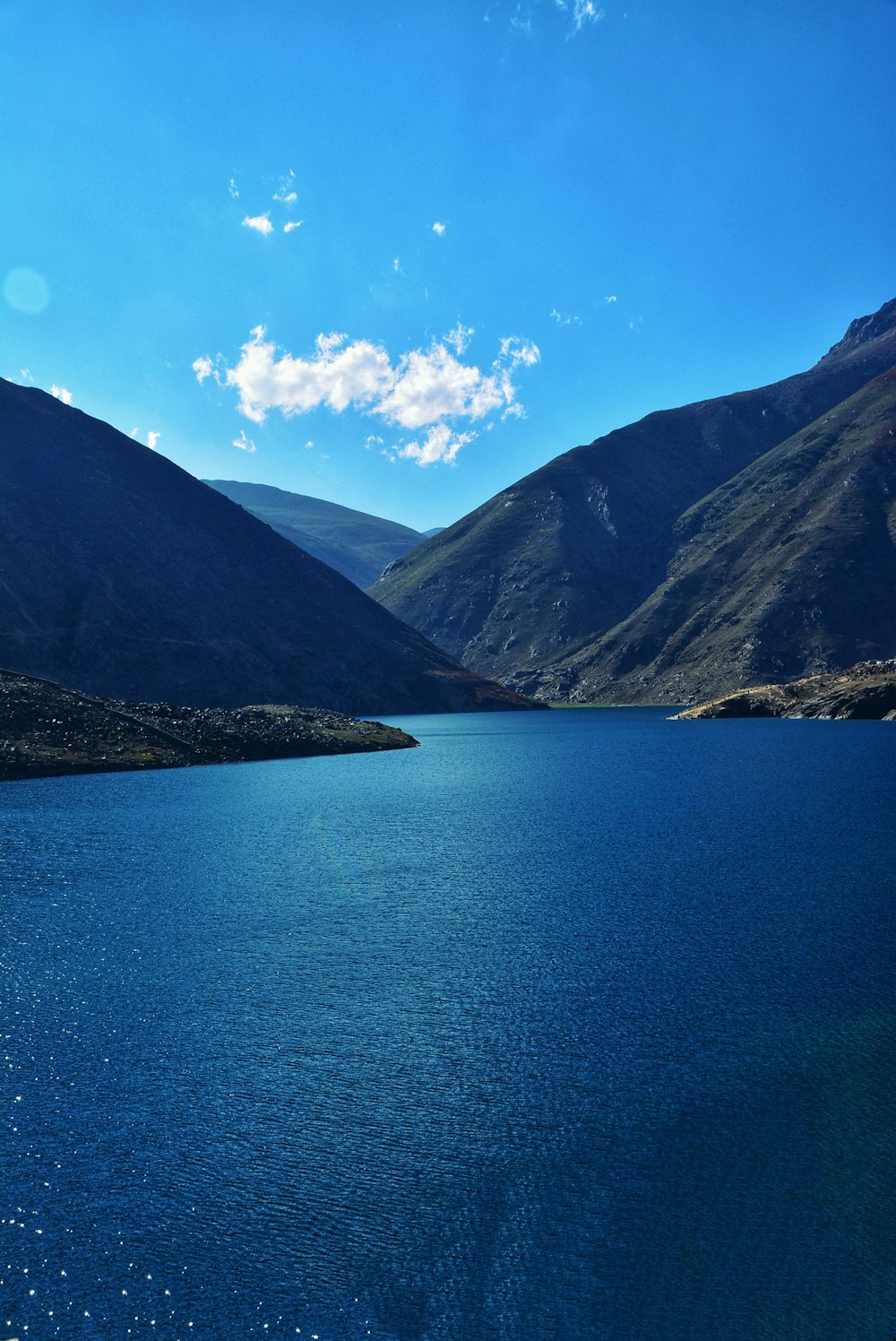 body of water across mountains