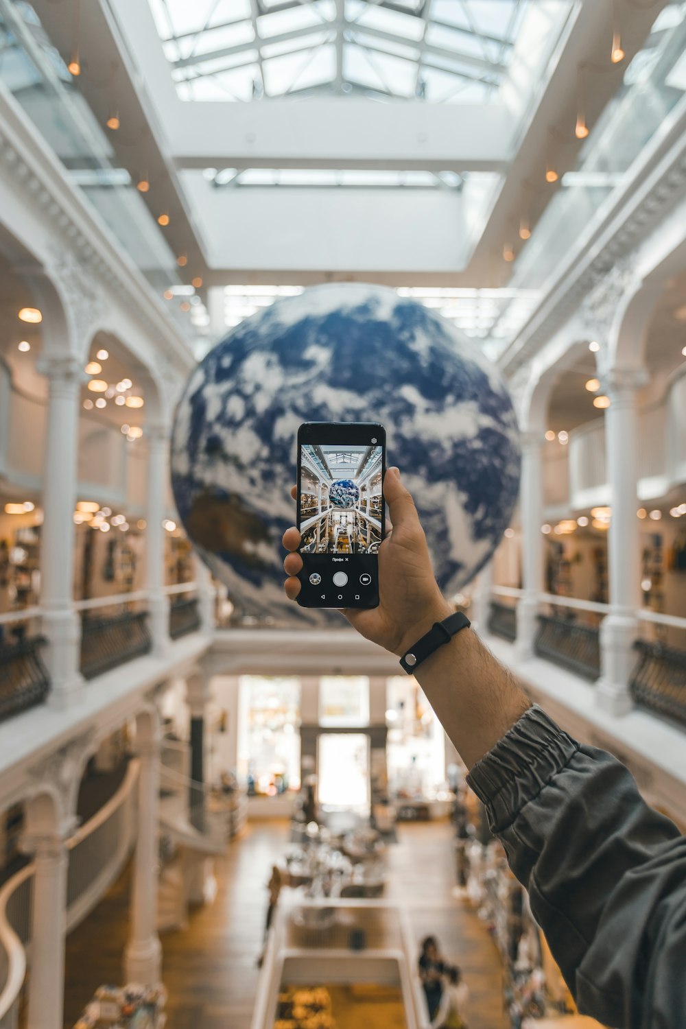 a person taking a picture of the inside of a building