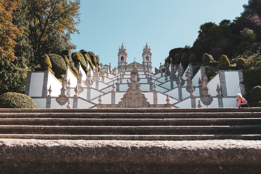 a person walking up some steps in front of a building