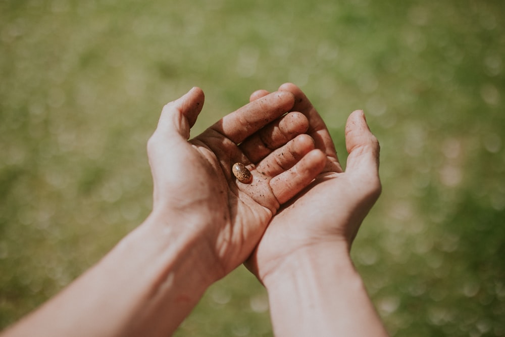 person's left hand over right hand