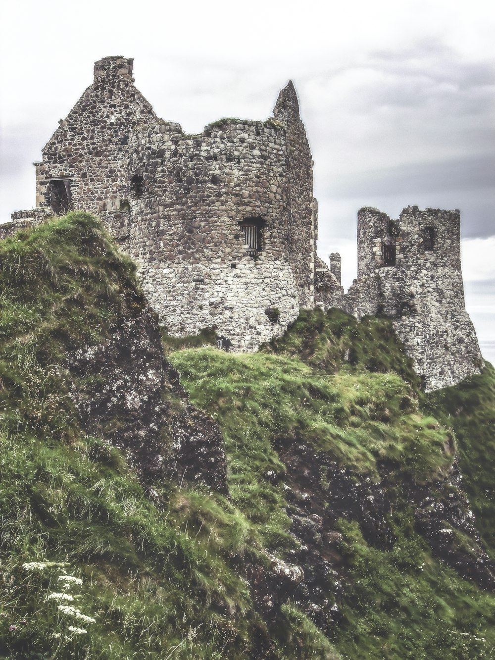 gray ruin house on top on mountain