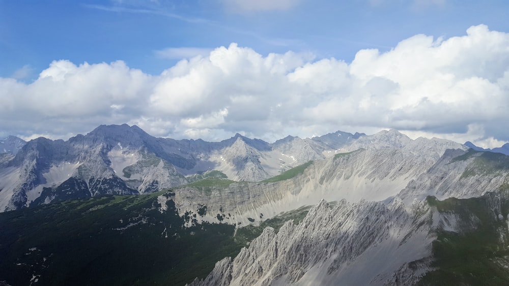 white mountain under white clouds