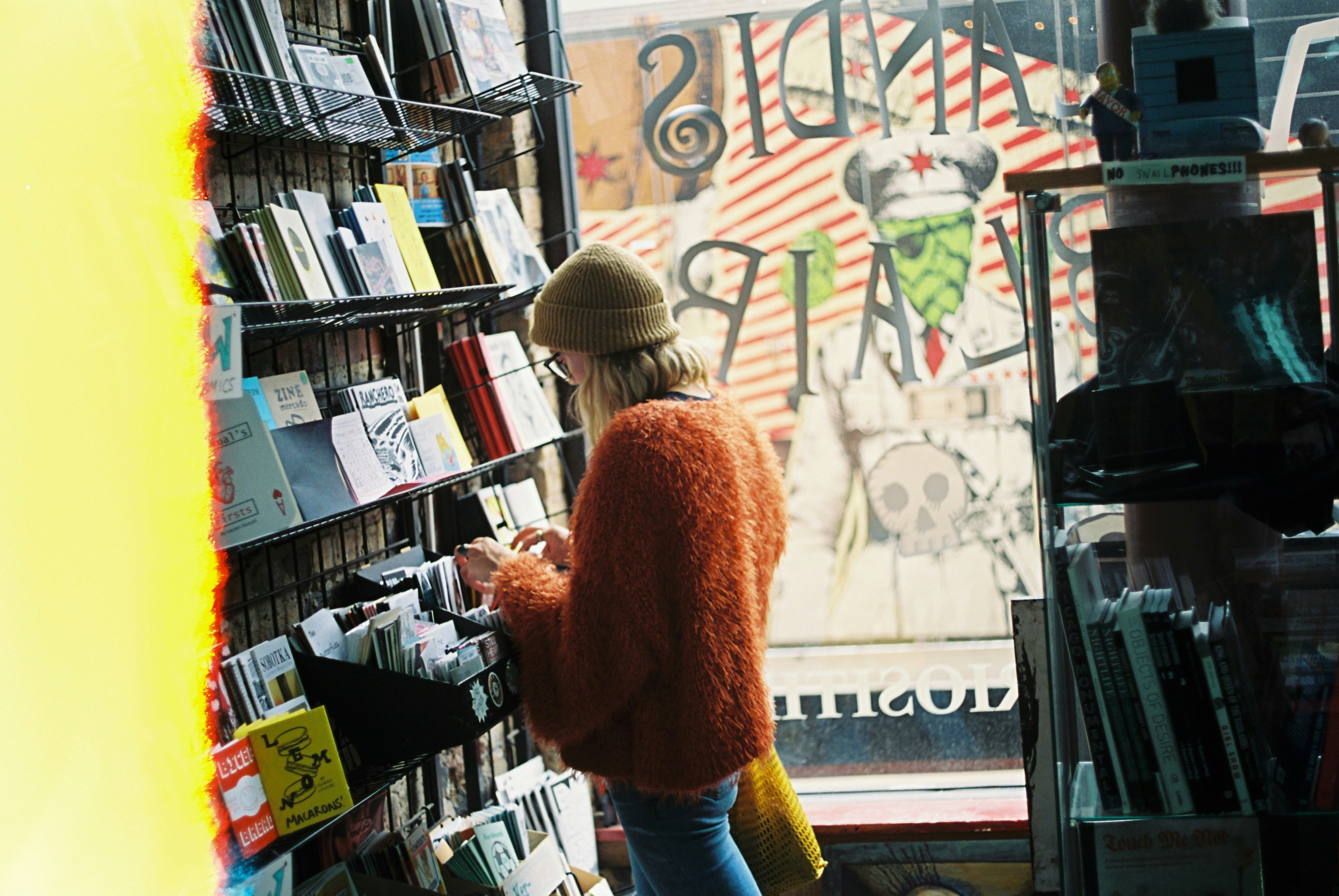 woman standing beside shelf