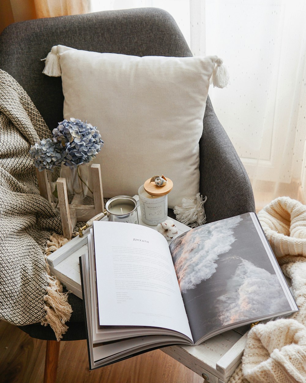 open book beside throw pillow