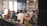A group of business professionals discussing products in a modern office setting.