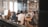 A group of business professionals discussing products in a modern office setting.