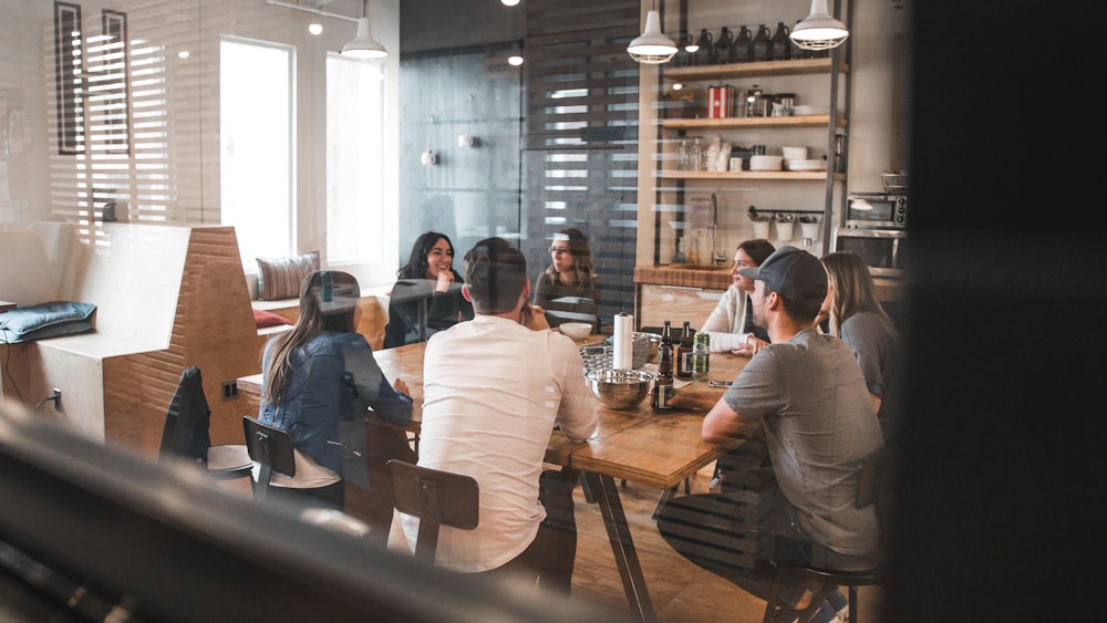 People sitting on chairs around a table in a collaborative meeting