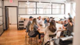 talking people sitting beside table