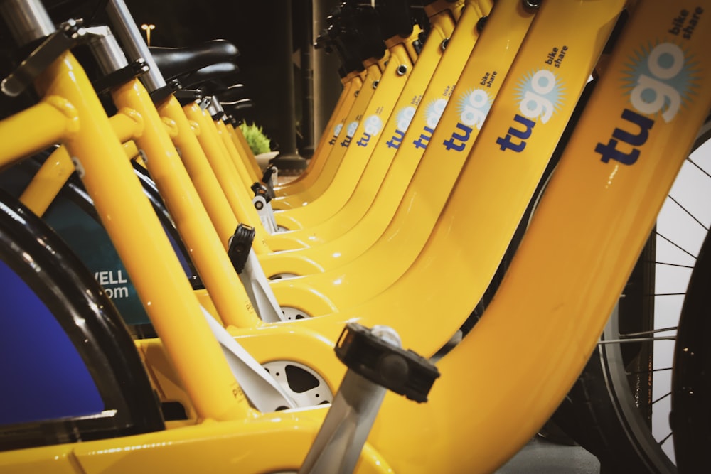 line of parked yellow Tugo bikes