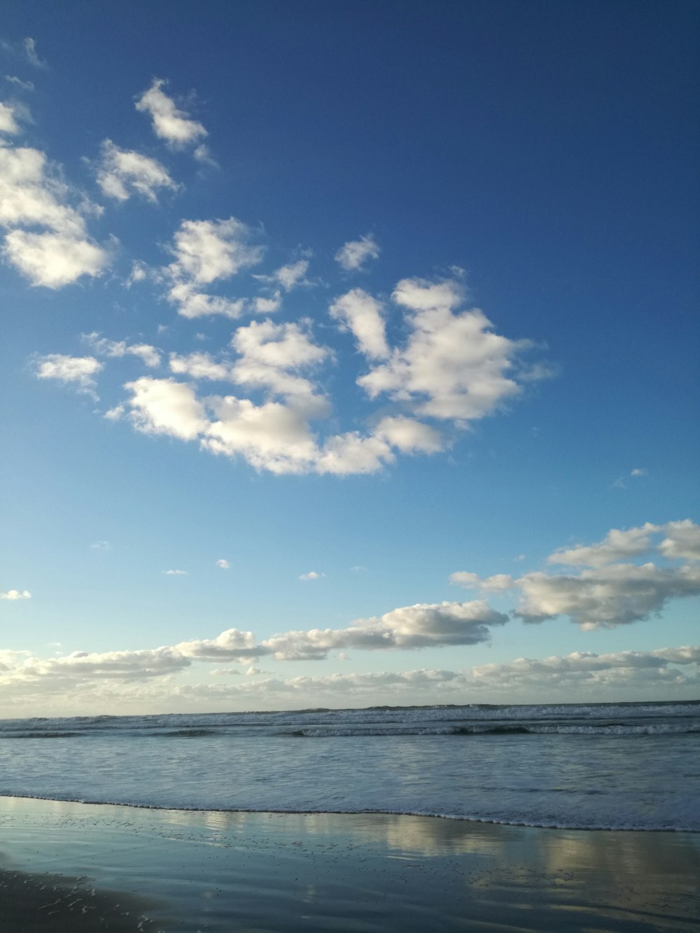 blue beach under blue sky