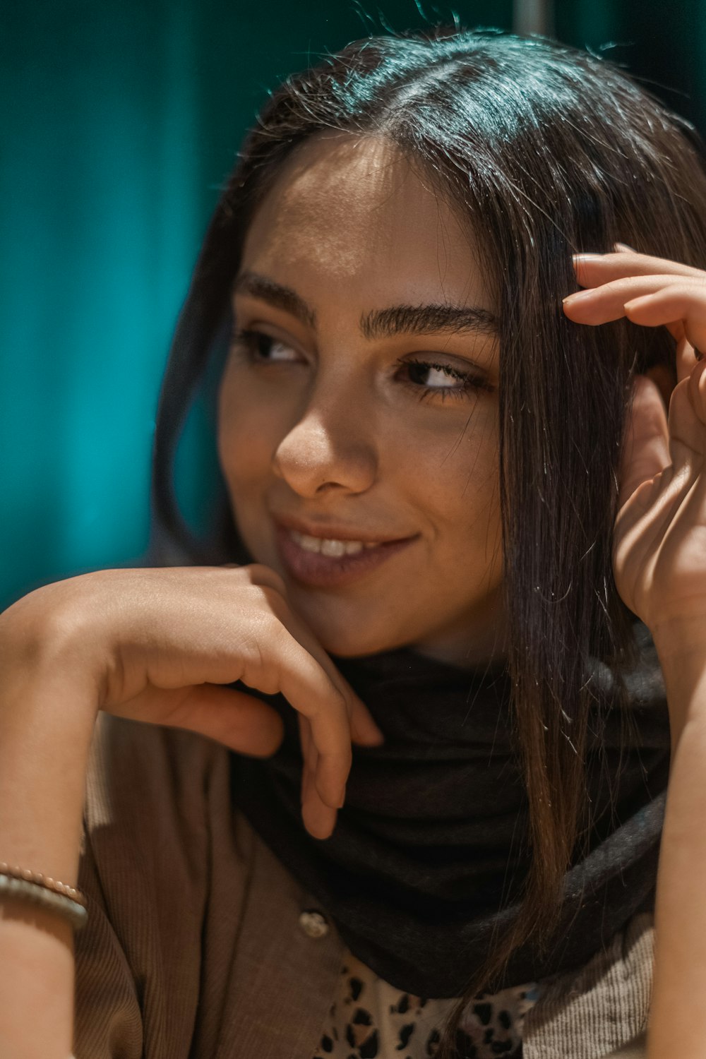 smiling woman wearing brown top