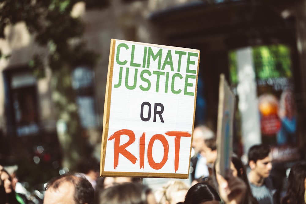 climate justice or riot signage
