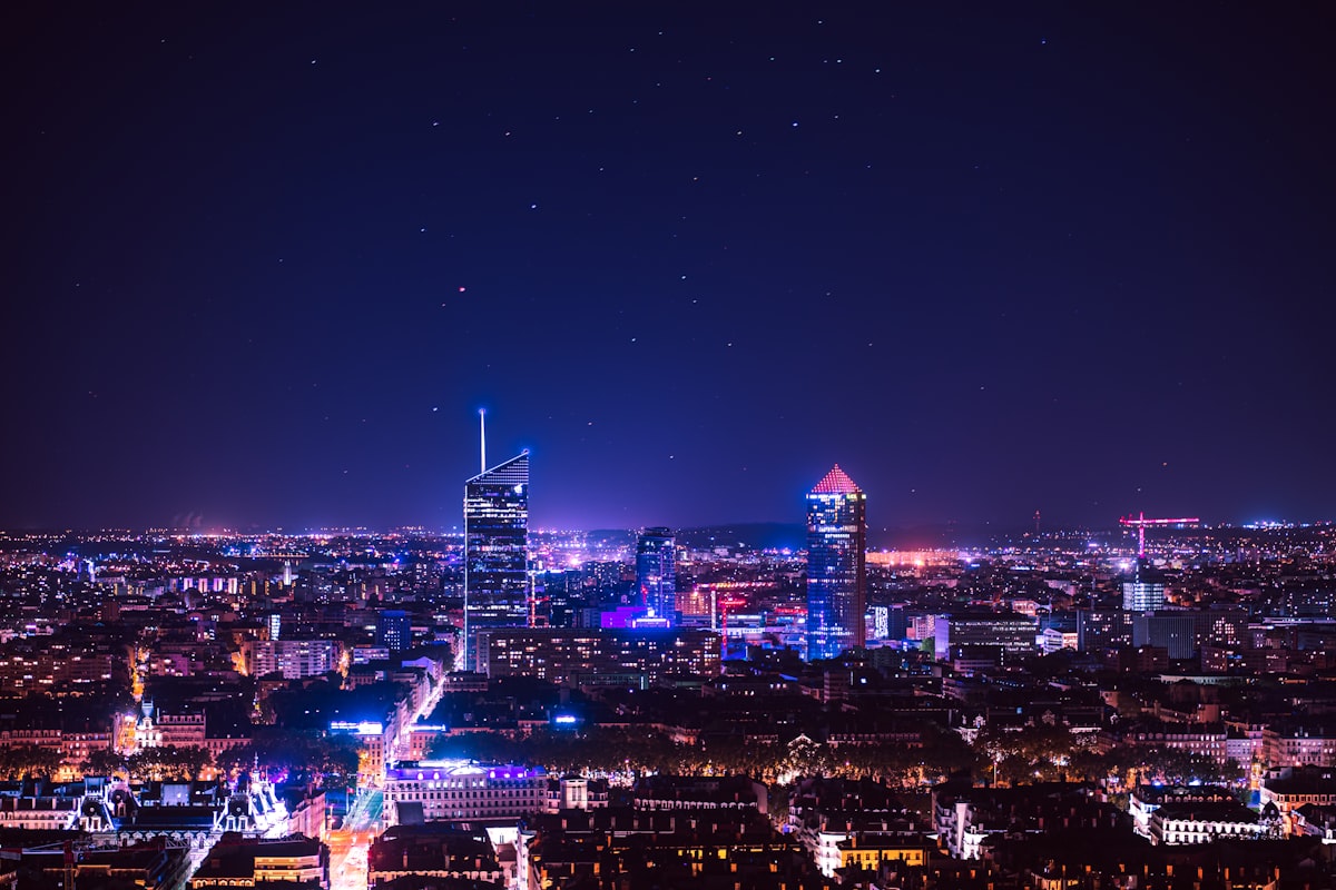 Modern illuminated buildings at night in Lyon Part-Dieu business district