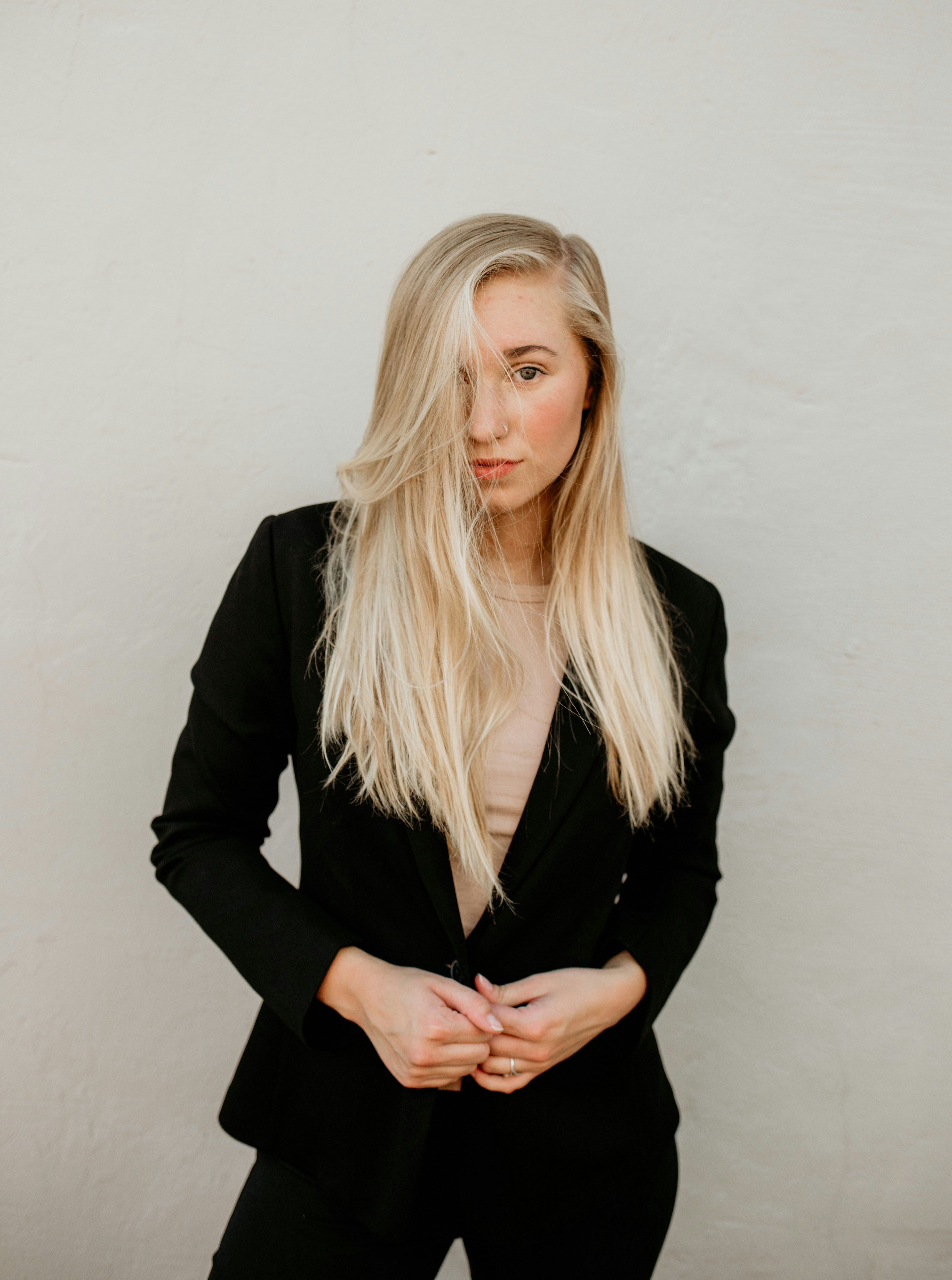 woman wearing black blazer standing