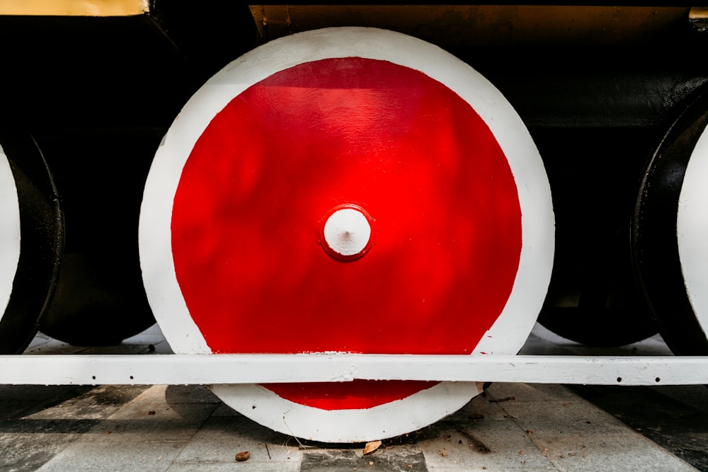 white and red train wheel
