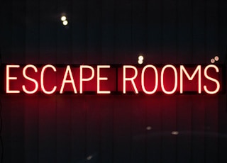 red escape rooms neon sign