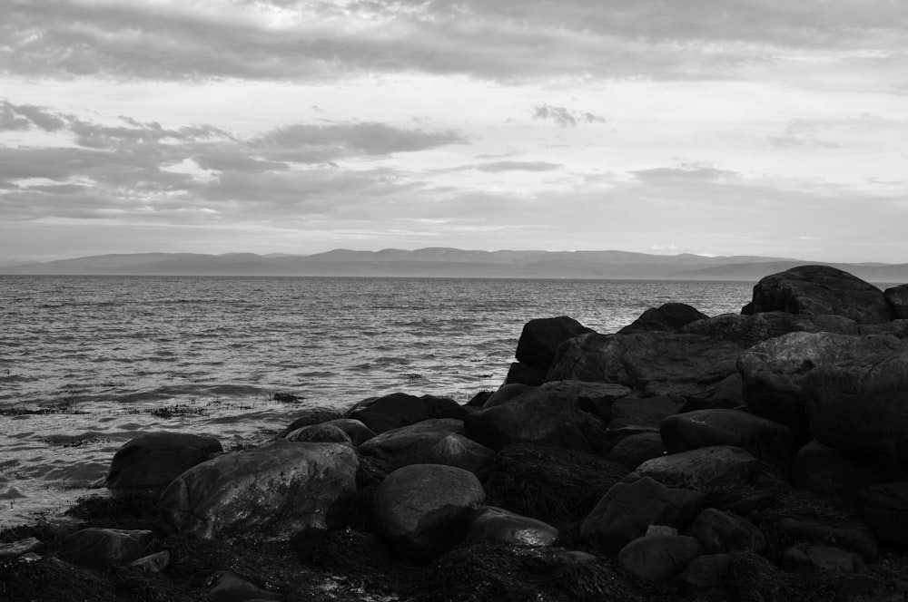 calm water by rocky shore