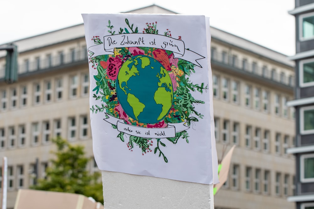 planet earth with flowers sign