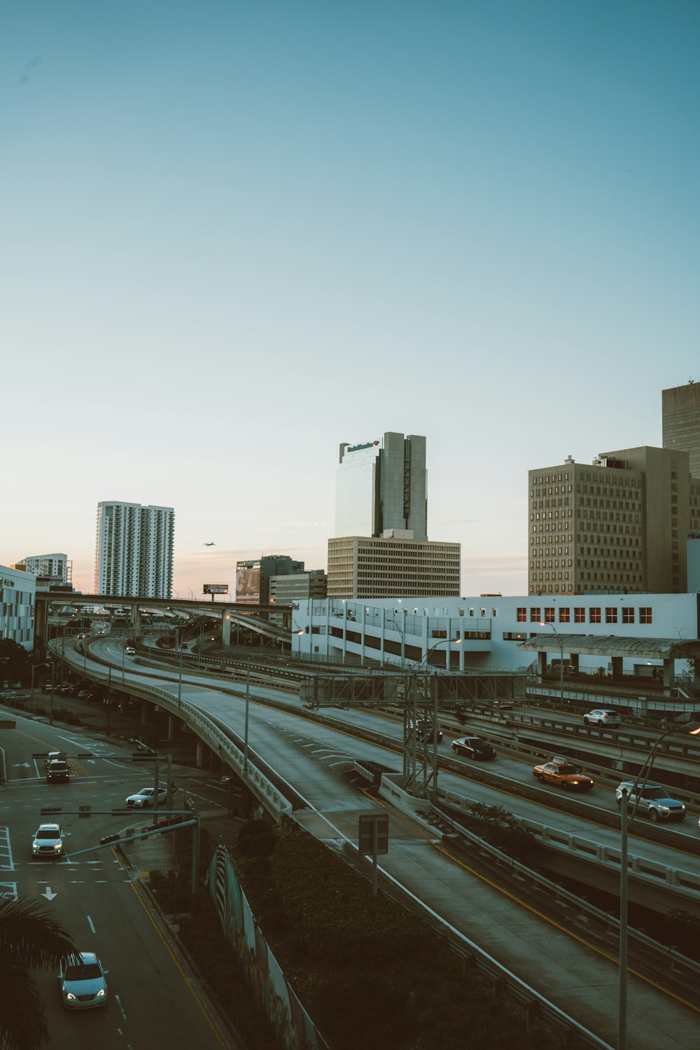 city and cars on roads during day