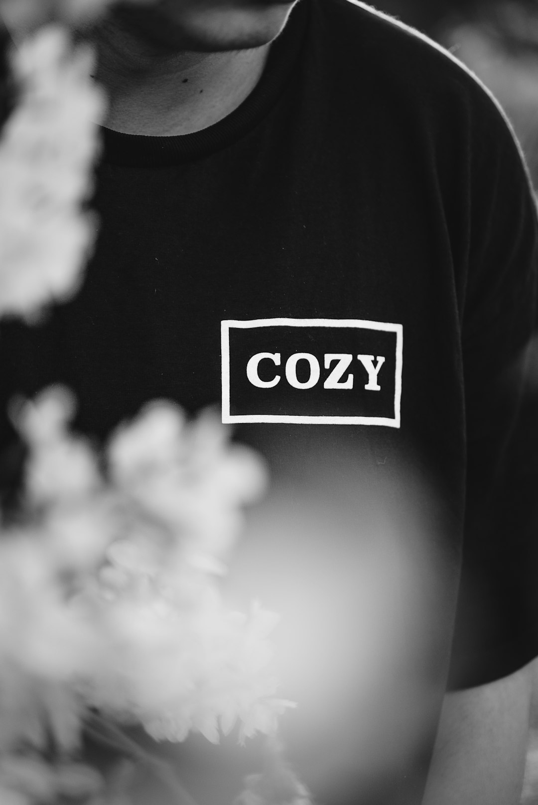 grayscale photography of man in shirt