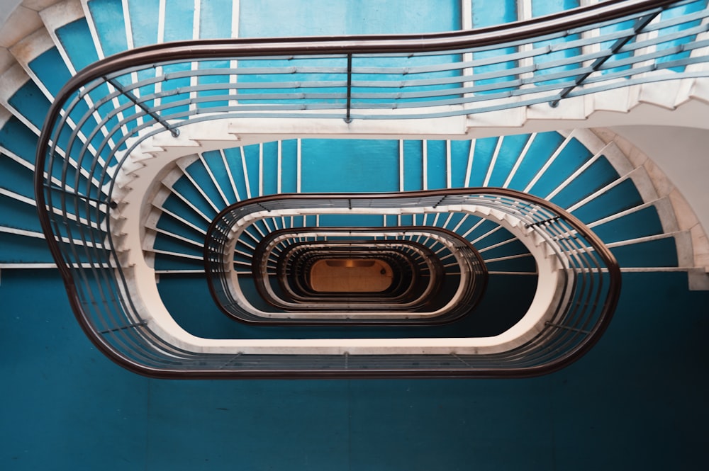 blue and white spiral stairs with no people