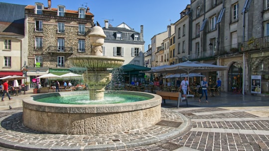 outdoor round fountain in Place de la Fontaine France