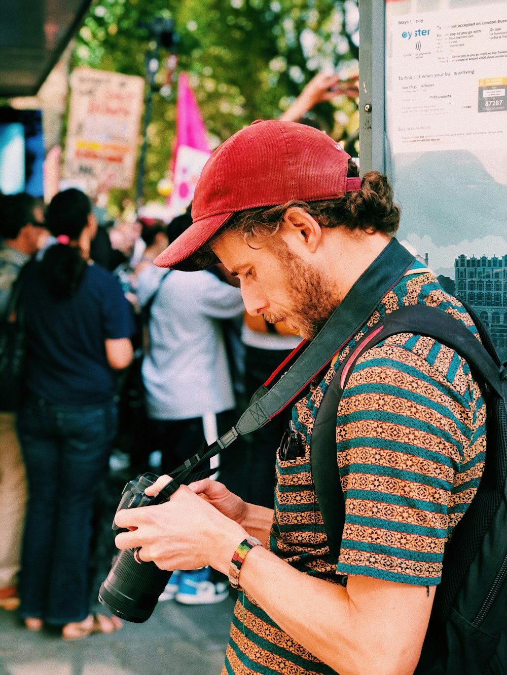 man holding camera during daytime