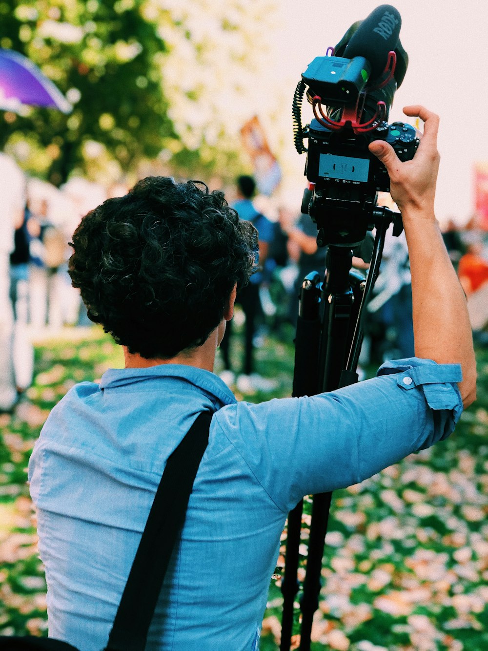 man holding DSLR camera