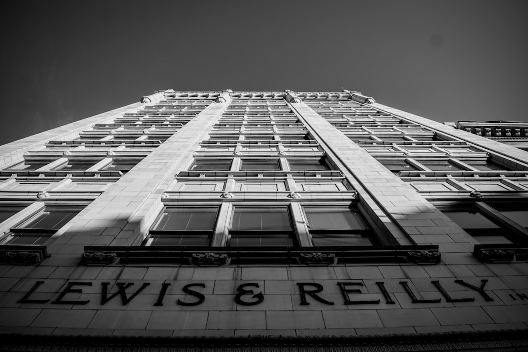 low-angle gray-scale photo of building