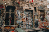 Graffiti art and rave flyers plastered on urban walls at night