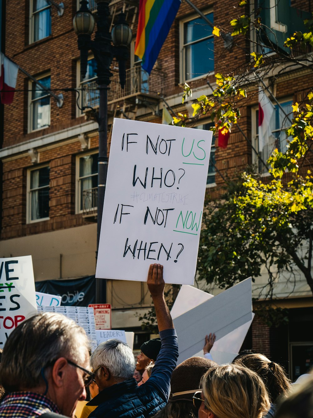 man holding if not us who poster