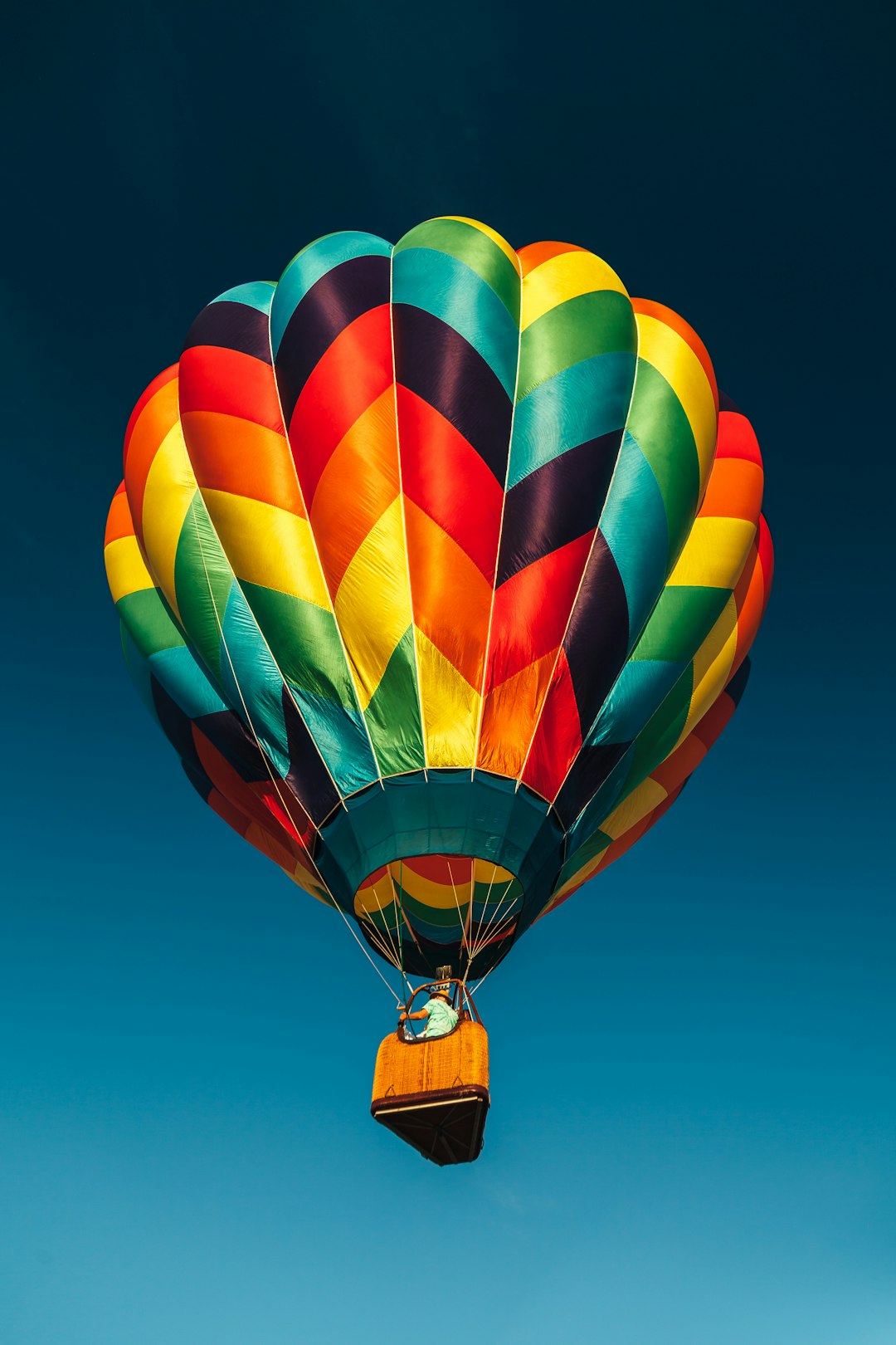 red and multicolored hot air balloon