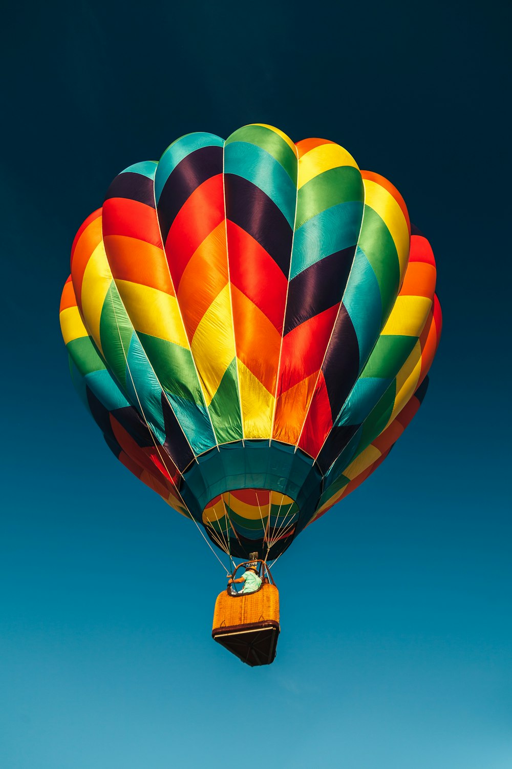 red and multicolored hot air balloon