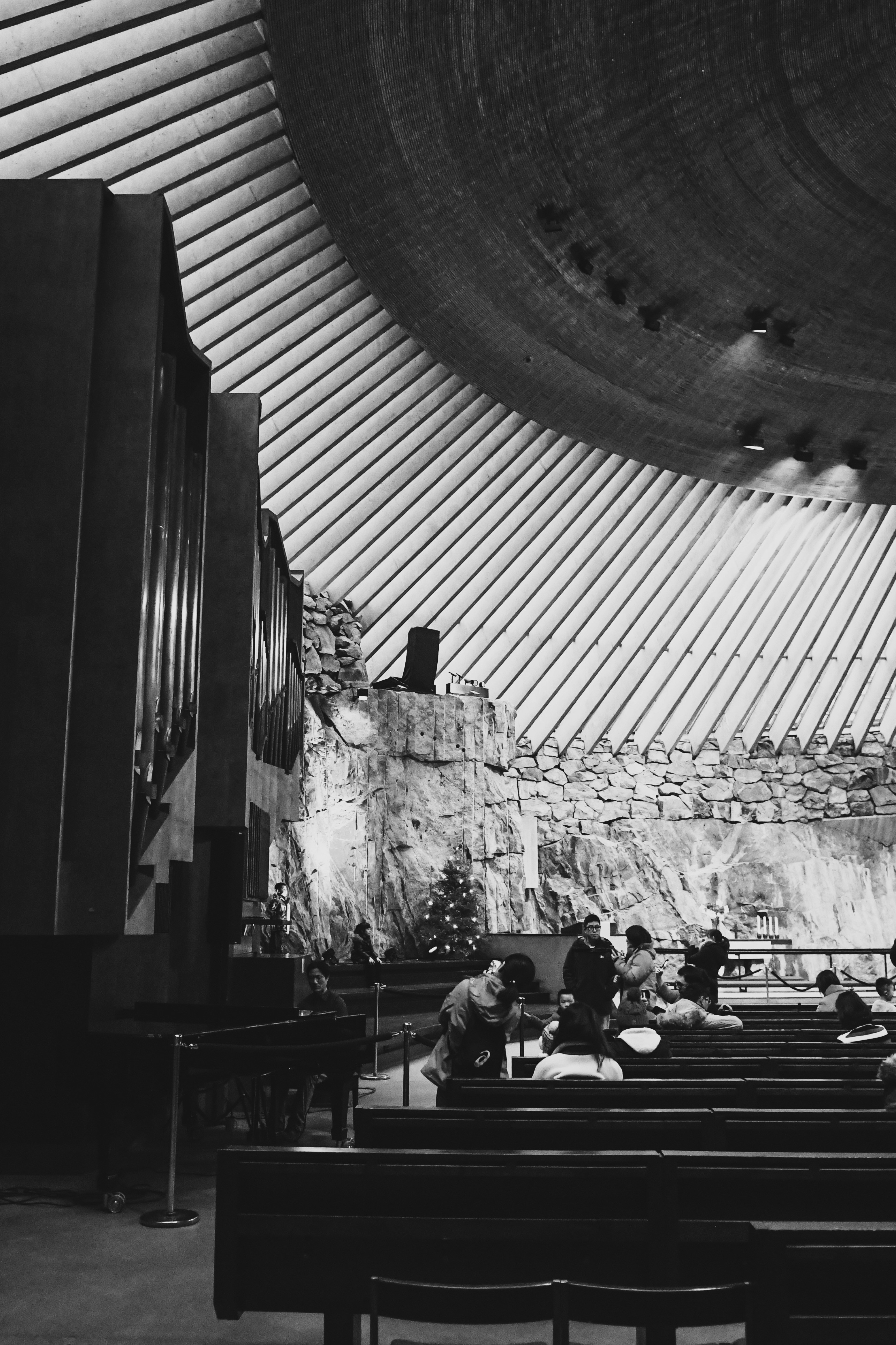 grayscale photography of people inside building