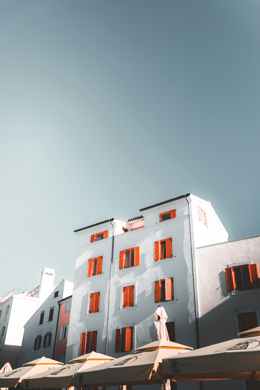 low-angle photography of white concrete building